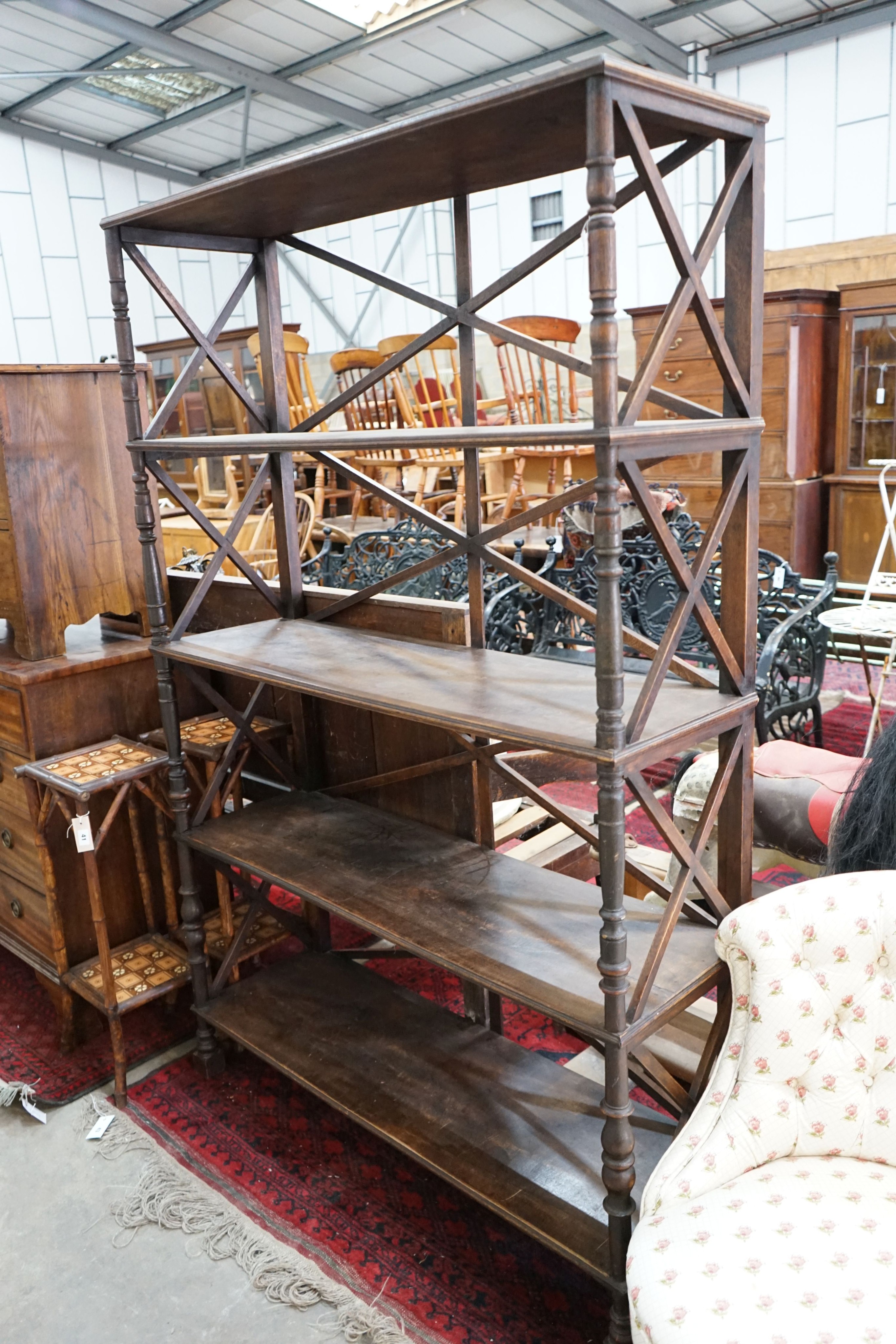 A Regency style four tier open bookcase, width 120cm, depth 38cm, height 184cm